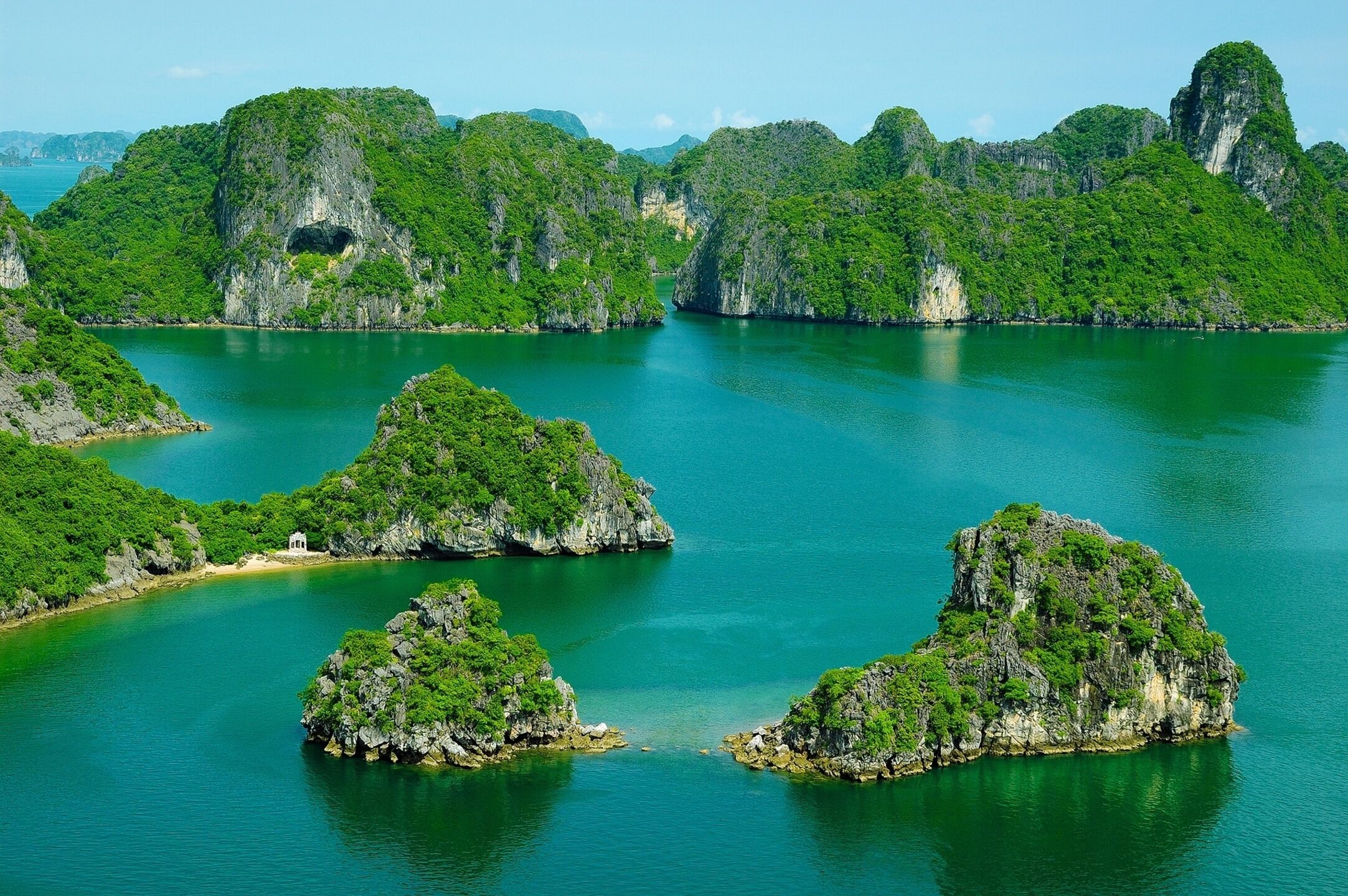 Sail through Vietnam’s iconic limestone karsts at sunrise