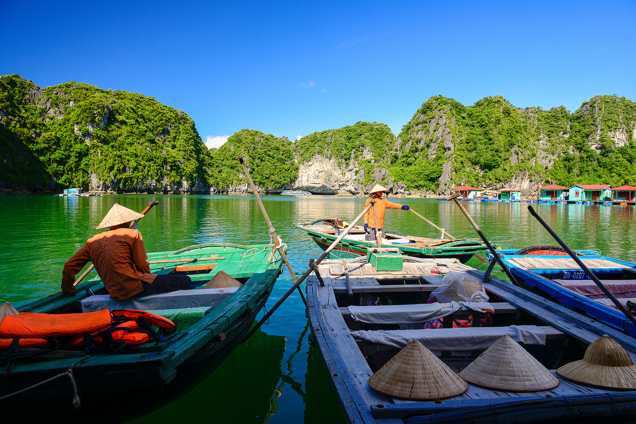 Sampan in Bai Tu Long Bay - Photograph the natural allure of Bai Tu Long’s caves