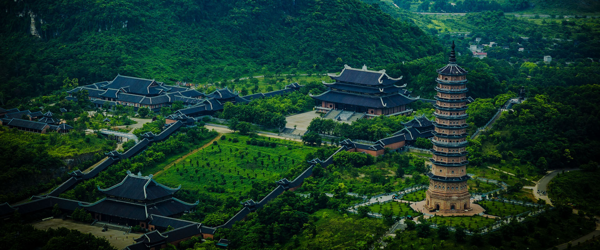Vibrant Ninh Binh landscape at dawn for a Ninh Binh Travel banner by Legend Travel Group.