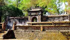 Serene Hue royal tombs landscape on a Hue Tours banner by Legend Travel Group.