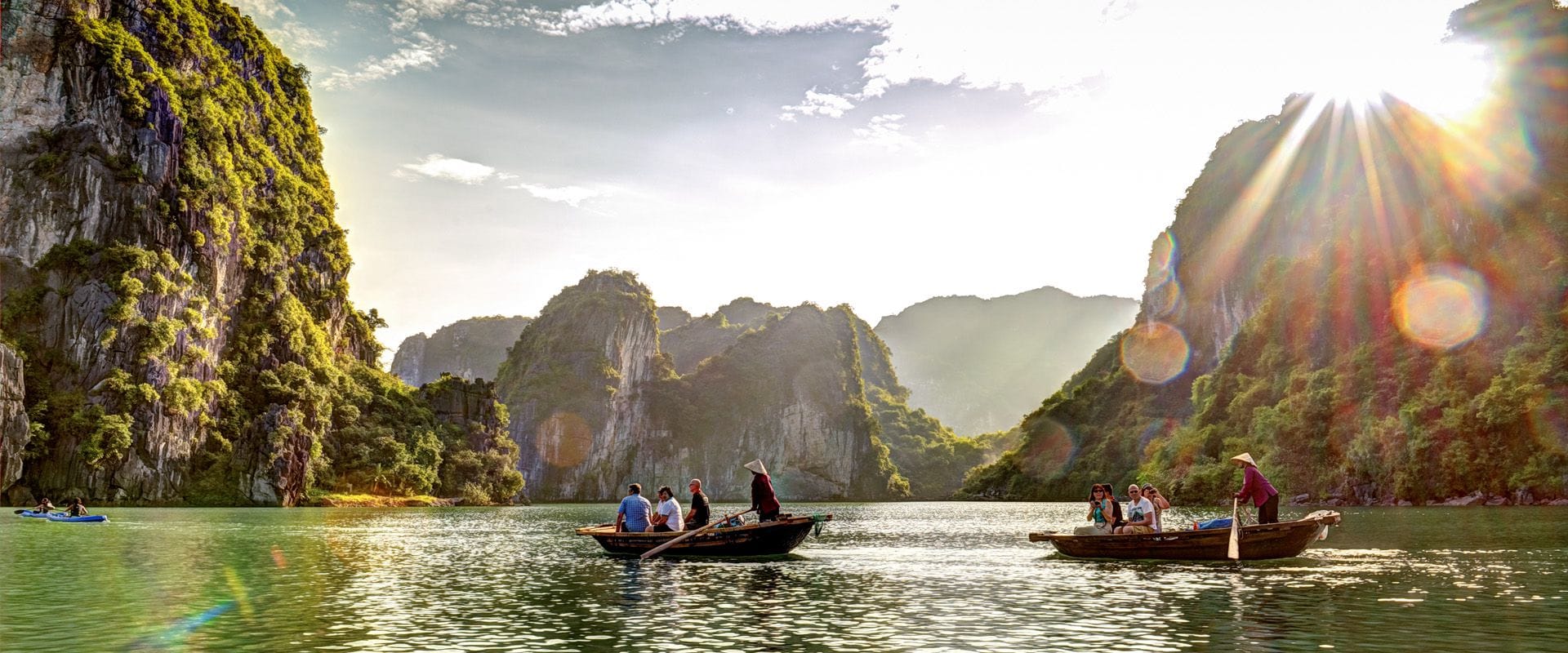 Halong Bay’s tranquil bays in Vietnam on a Halong Bay Travel banner by Legend Travel Group.