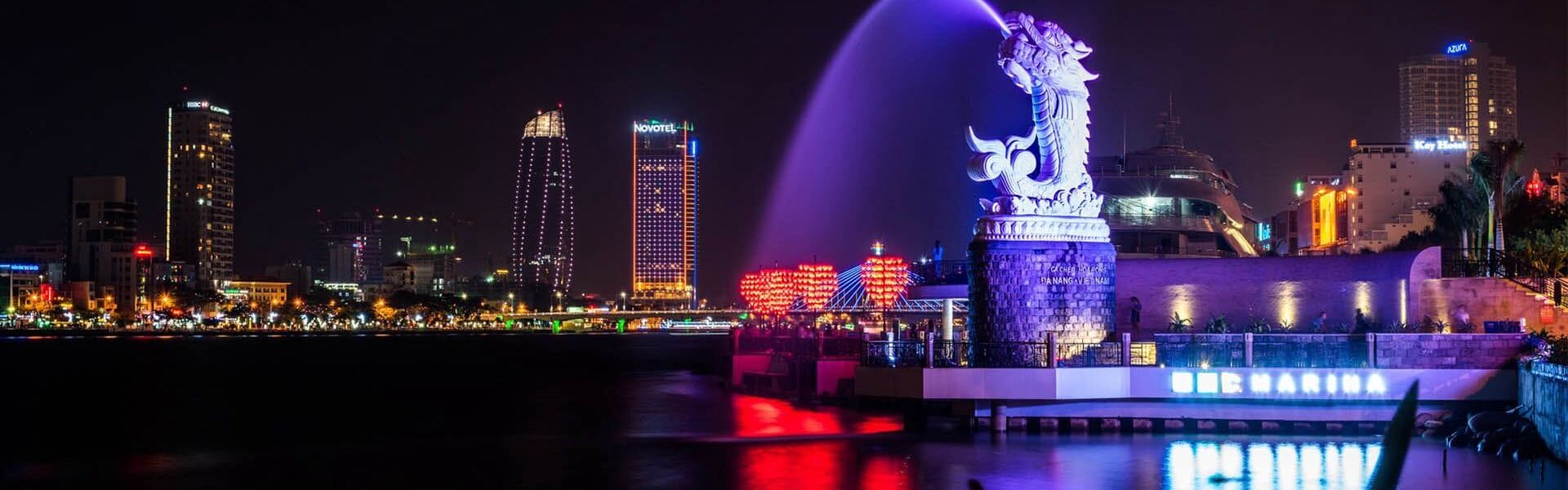 Da Nang’s vibrant cityscape in Vietnam on a Da Nang Travel banner by Legend Travel Group.