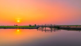 Tranquil Chau Doc delta canals in Vietnam for a Chau Doc Tours banner by Legend Travel Group.