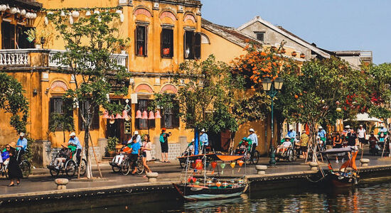 Tranquil Hoi An riverside at dusk for a Hoi An Tours banner by Legend Travel Group.