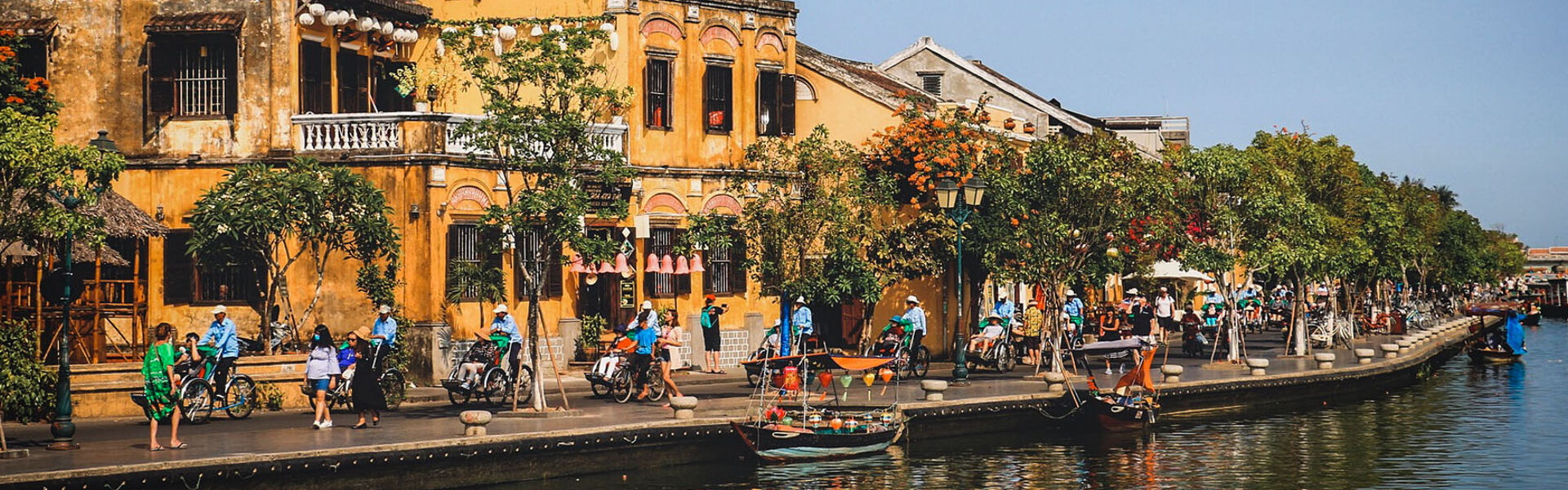 Tranquil Hoi An riverside at dusk for a Hoi An Tours banner by Legend Travel Group.