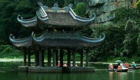 Panoramic view of Ninh Binh’s ancient temples for a scenic Ninh Binh Tours banner by Legend Travel Group.
