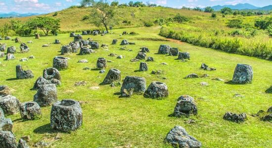 Panoramic view of Xieng Khouang’s Plain of Jars for a Xieng Khouang Tours banner by Legend Travel Group.