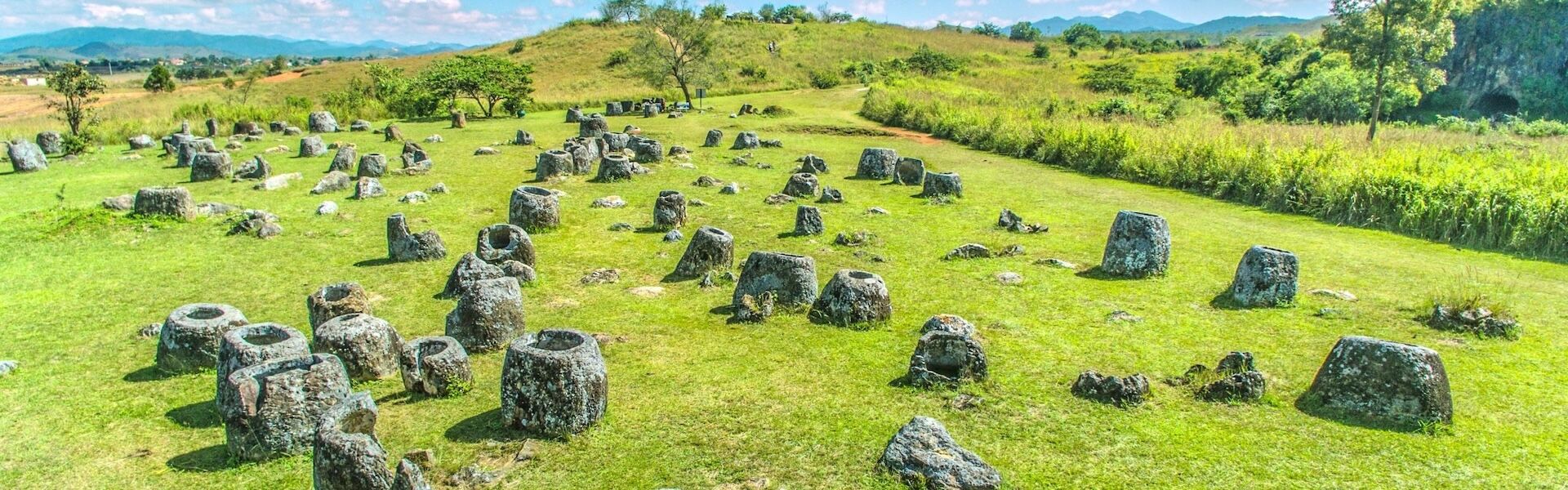 Panoramic view of Xieng Khouang’s Plain of Jars for a Xieng Khouang Tours banner by Legend Travel Group.