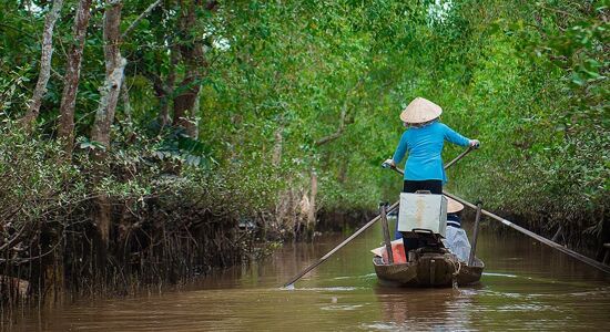 Panoramic view of Can Tho’s delta canals for a scenic Can Tho Tours banner by Legend Travel Group.