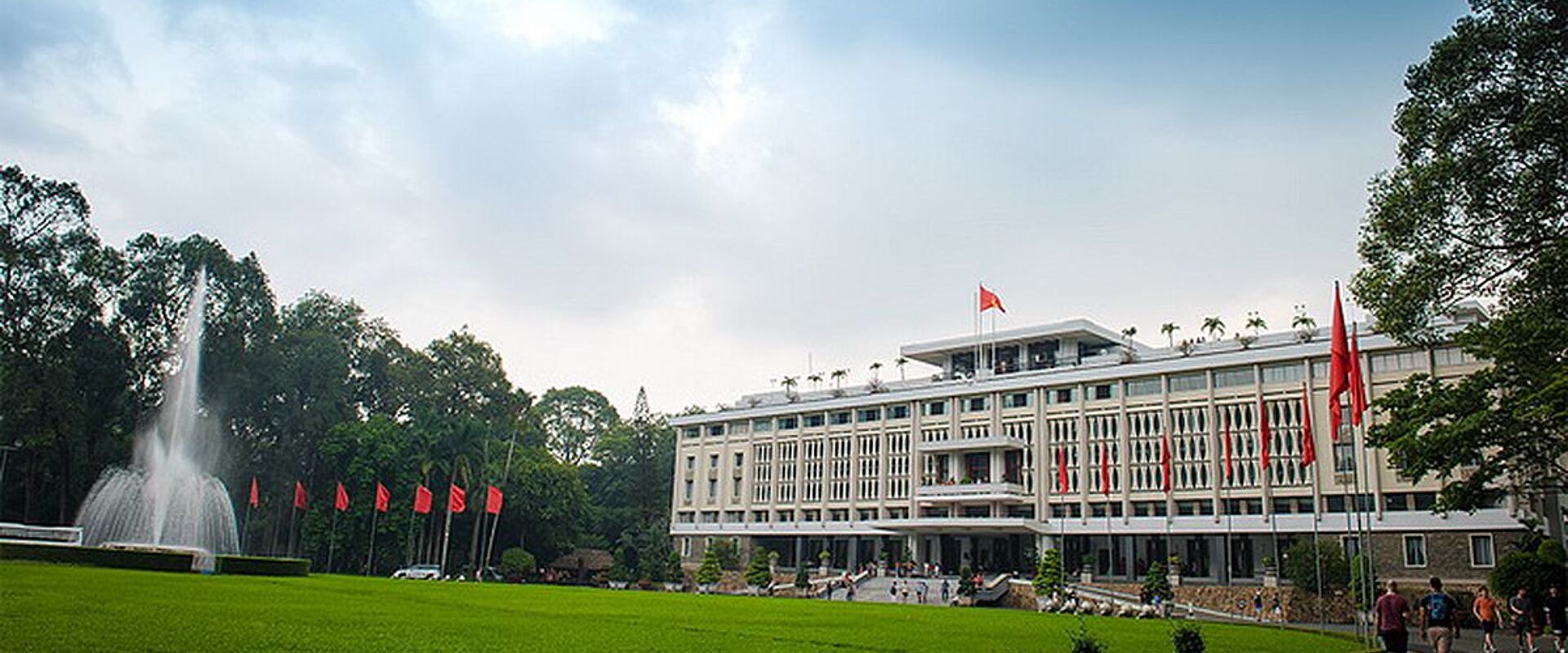 Tranquil Ho Chi Minh City Independent Palace at dawn for a Ho Chi Minh City Travel banner by Legend Travel Group.