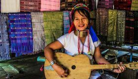 Mae Klong Ethnic Girl play Guitar
