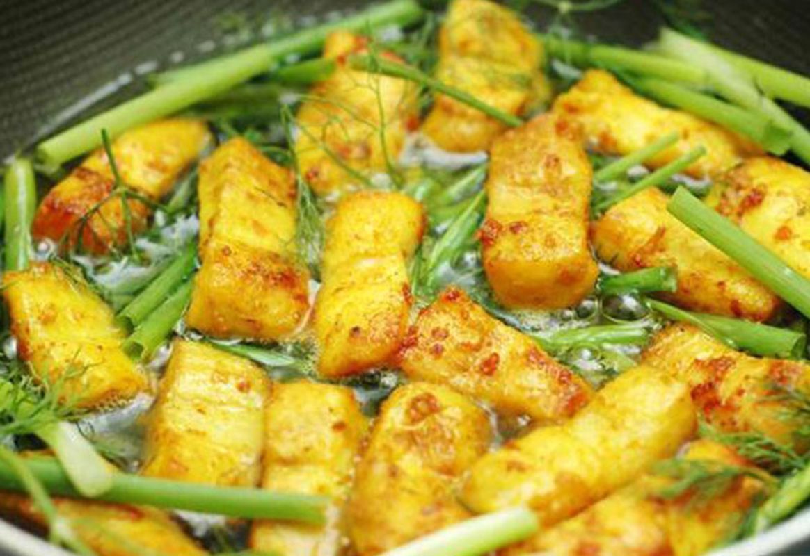 Fish cooked with turmeric and dill - Photograph the vibrant allure of Hanoi’s cuisine