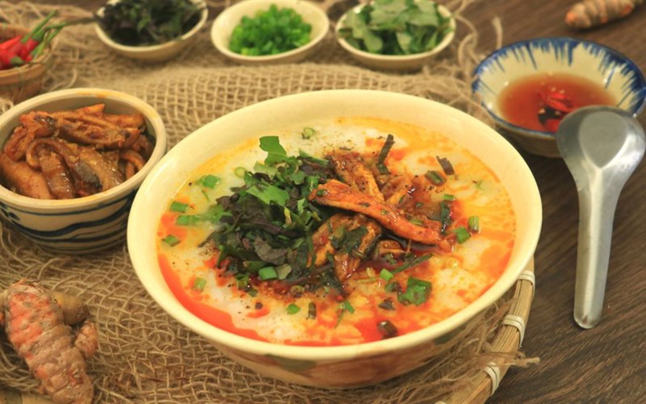 Dive into the vibrant flavors of Cháo Lươn Bà Liễu Quán Bàu Travel