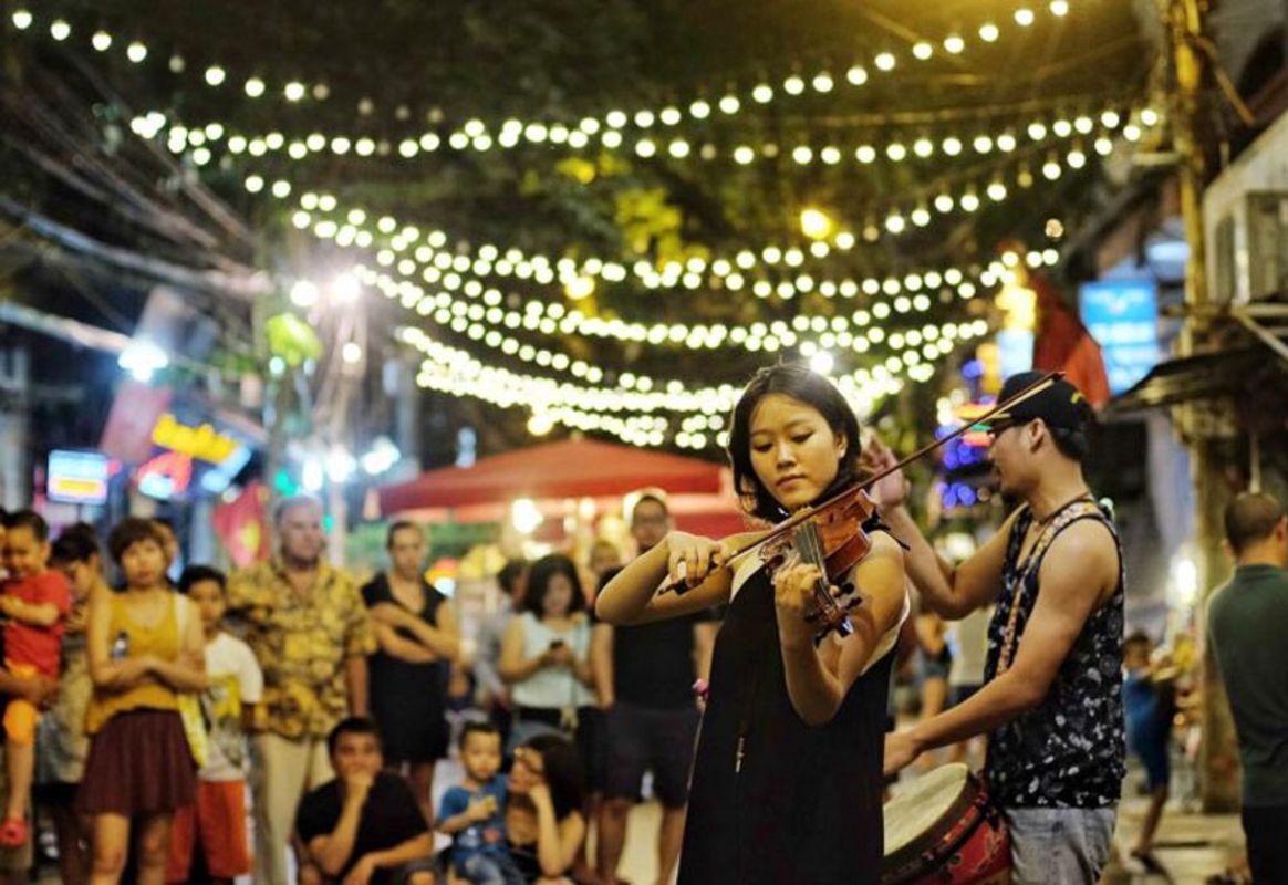 Street music performance - Begin your Hanoi Tours with a scenic adventure