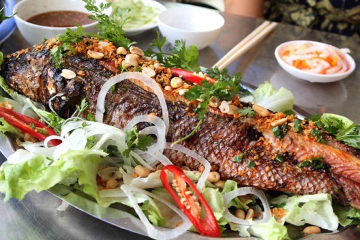 Snakehead Fish smoked in rice straw "Cá lóc nướng rơm"