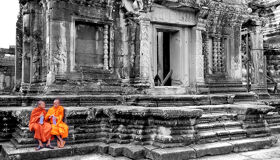 Buddhist Monks sitting at the Angkor Temples, Siem Reap