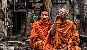 Buddhist senior Monk teaching for junior Monk at Angkor Complex, Siem Reap, Cambodia