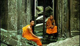 Buddhist Monks sitting in the Angkor Temples, Cambodia