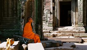 Buddhist Monk sitting in the Temple, Angkor Complex