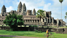 Little Kid cycling near Angkor Wat, Siem Reap, Cambodia