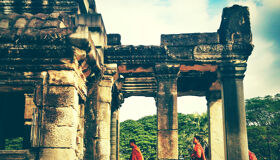 Buddhist Monks walking at Angkor Temples, Siem Reap