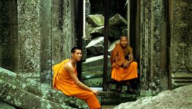 Buddhist Monks sitting at Angkor Temples, Siem Reap, Cambodia
