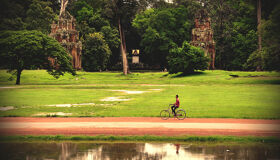 Local man cycling in Angkor Complex, Siem Reap, Cambodia