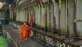 Buddhist Monks walking in the Angkor Temple, Siem Reap