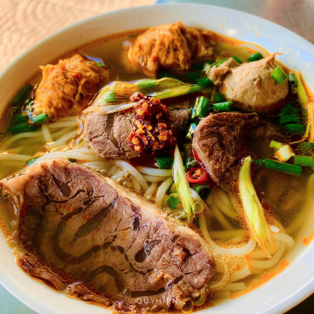 Savor spicy flavors with friends on a Hue food tour
