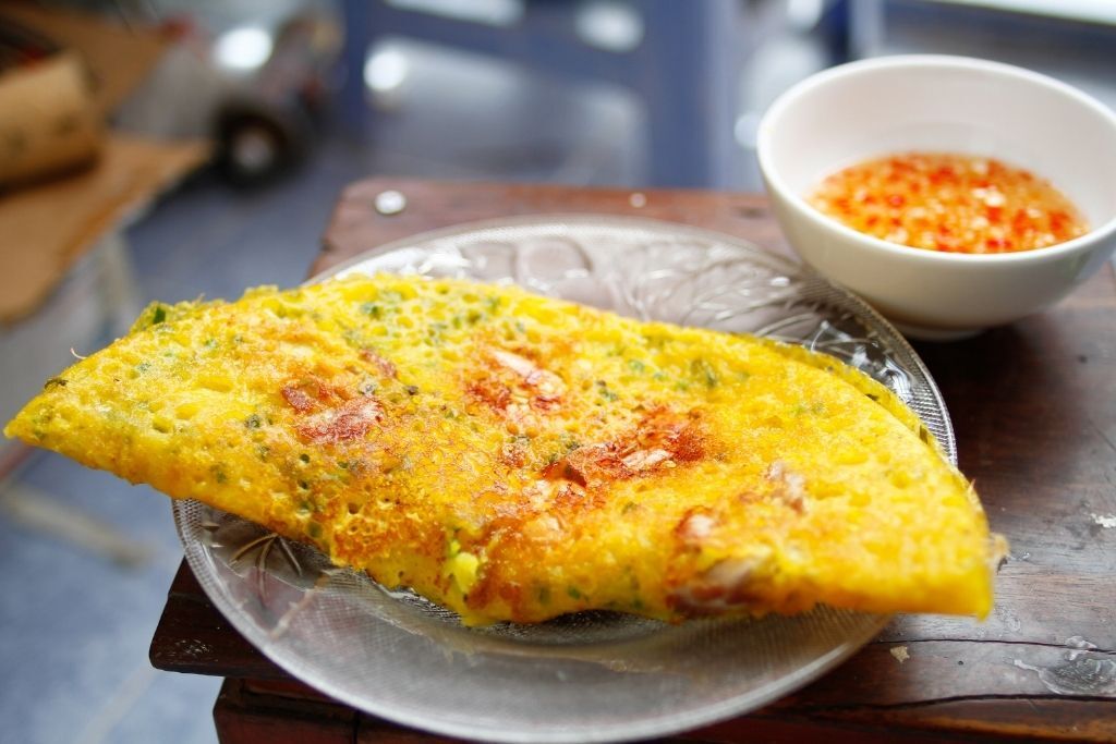 Enjoy Hue’s savory pancakes with nuoc cham