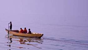 Buddhist Monks and locals` Boat on Tonle Sap Lake, Cambodia