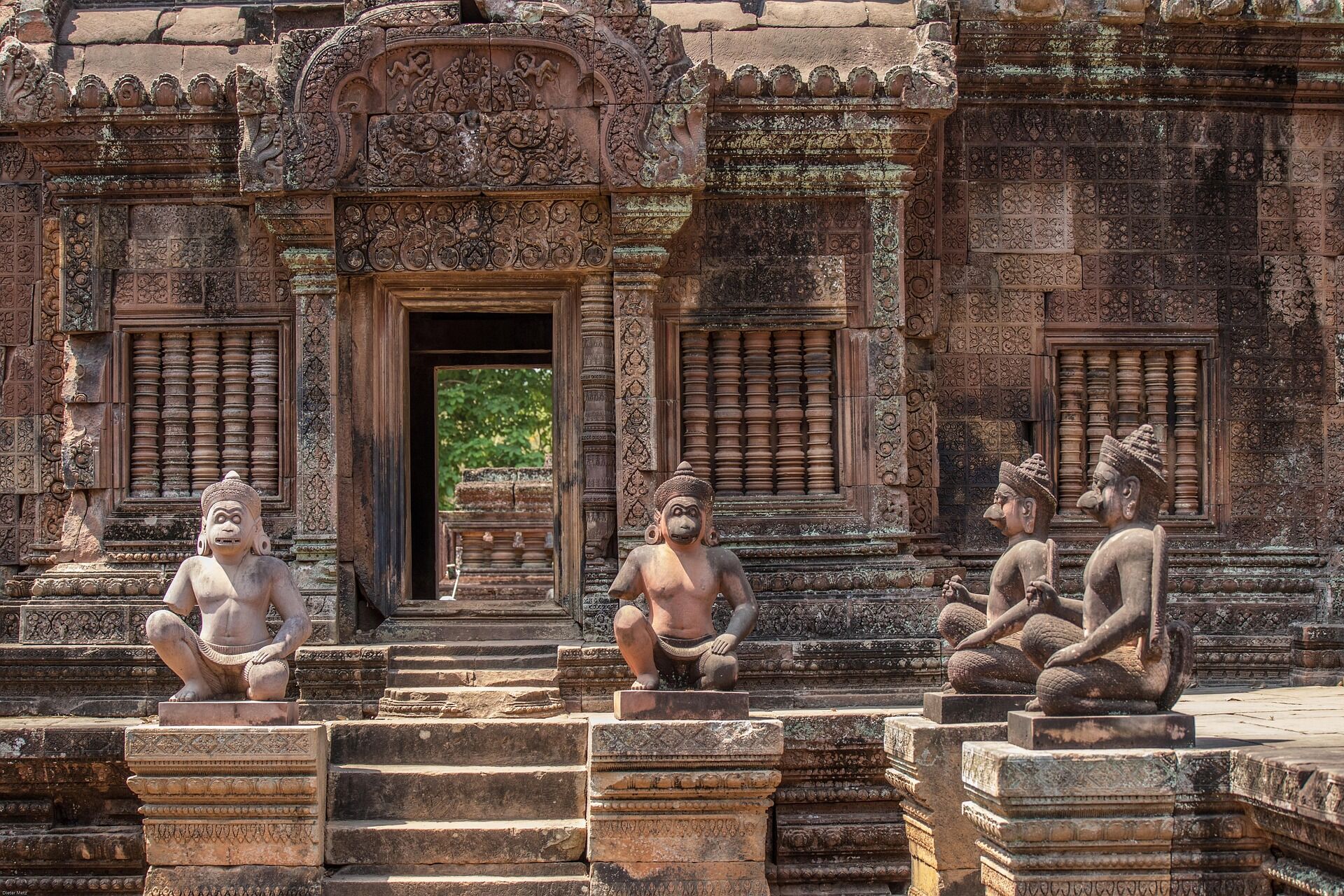 Admire intricate artistry in rose-hued stone