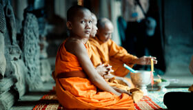Buddhist Monks sitting at Angkor Temples