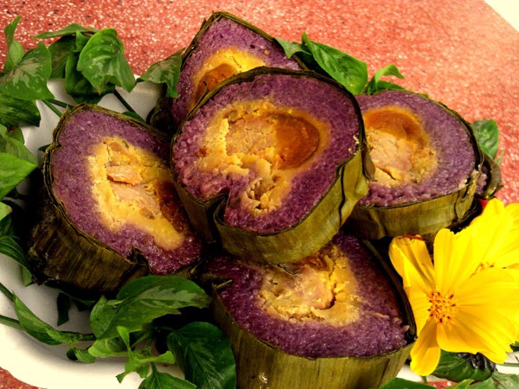 Violet cylindrical glutinous Rice Cake - “Bánh tét lá cẩm”