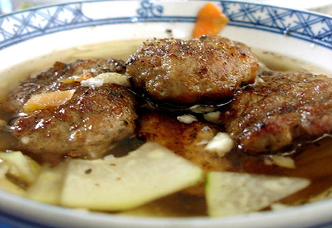 Capture the savory essence of Hanoi’s street food gem