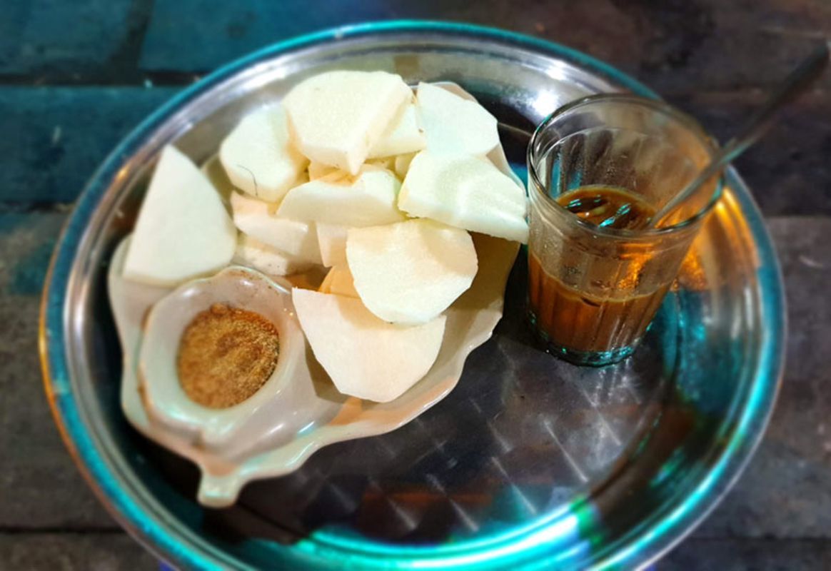 Capture the vibrant essence of Hanoi’s sidewalk coffee culture