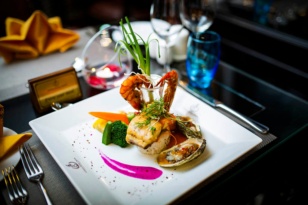 Enjoy fresh seafood dishes prepared in elegant onboard restaurants