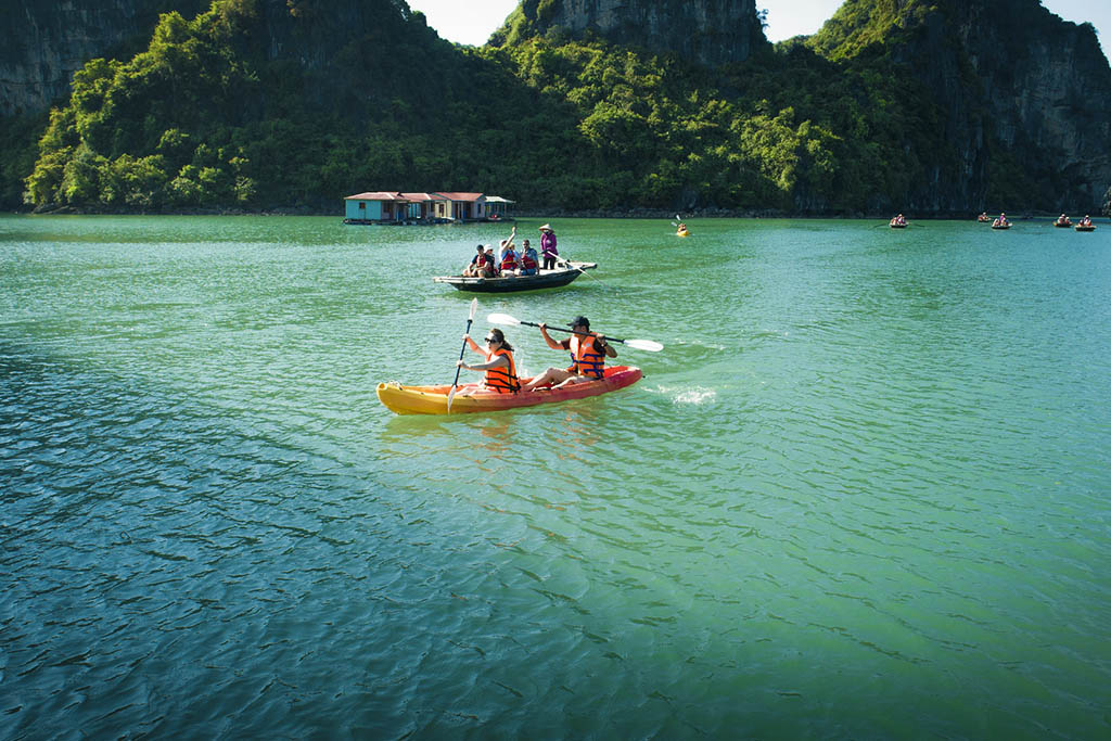 Explore calm emerald waters at your own pace by kayak