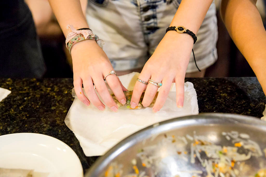 Learn to make traditional spring rolls with expert chefs at sea