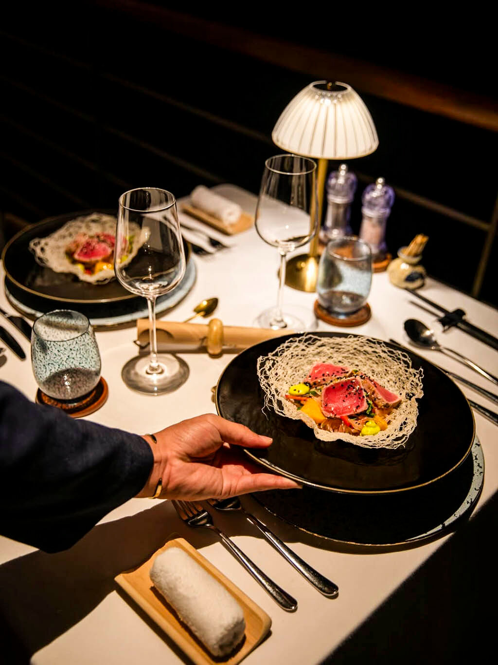 Savor gourmet dining while anchored among Halong Bay’s islands