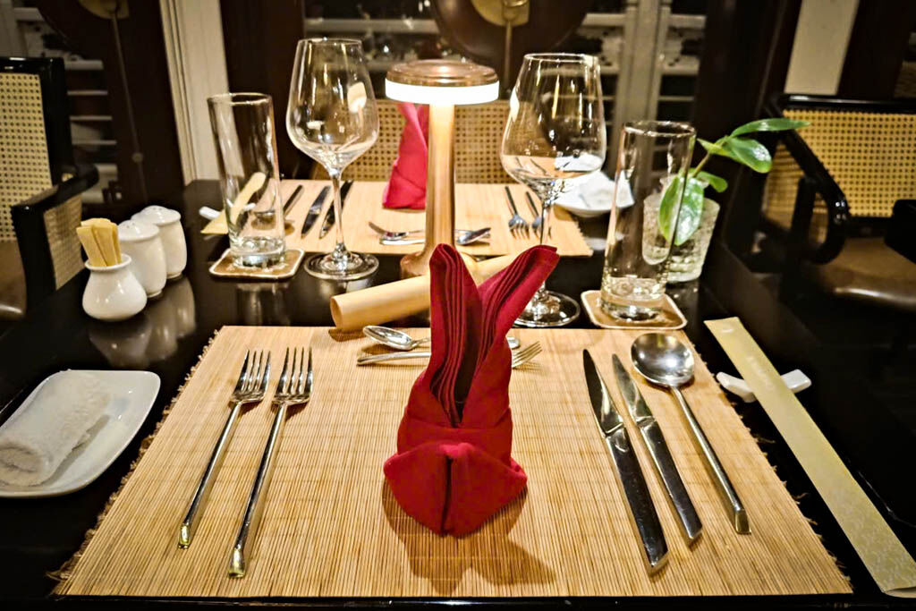 Savor candlelit dinners on deck as night embraces the bay