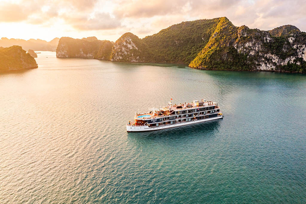 Awaken to Halong Bay’s golden glow