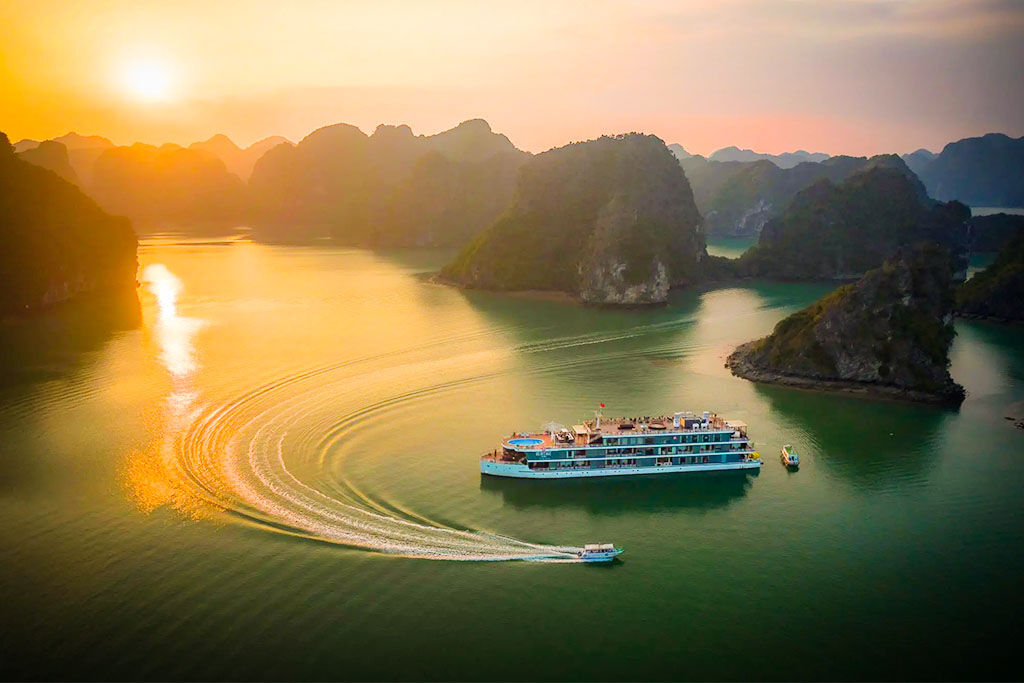 Sail through Vietnam’s iconic limestone karsts at sunrise