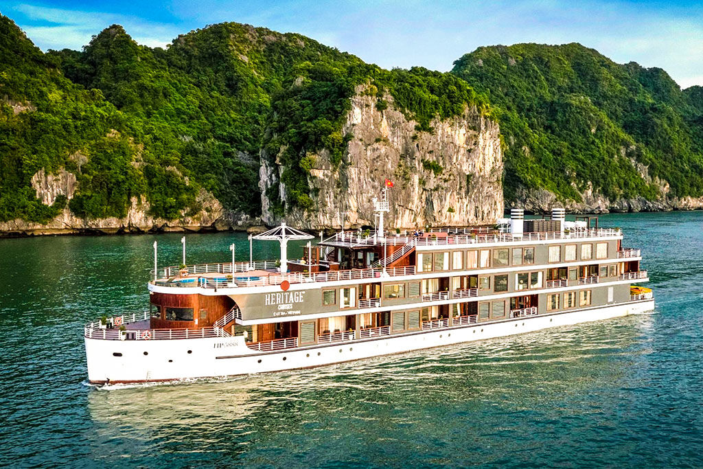 Sail through Vietnam’s iconic limestone karsts at sunrise
