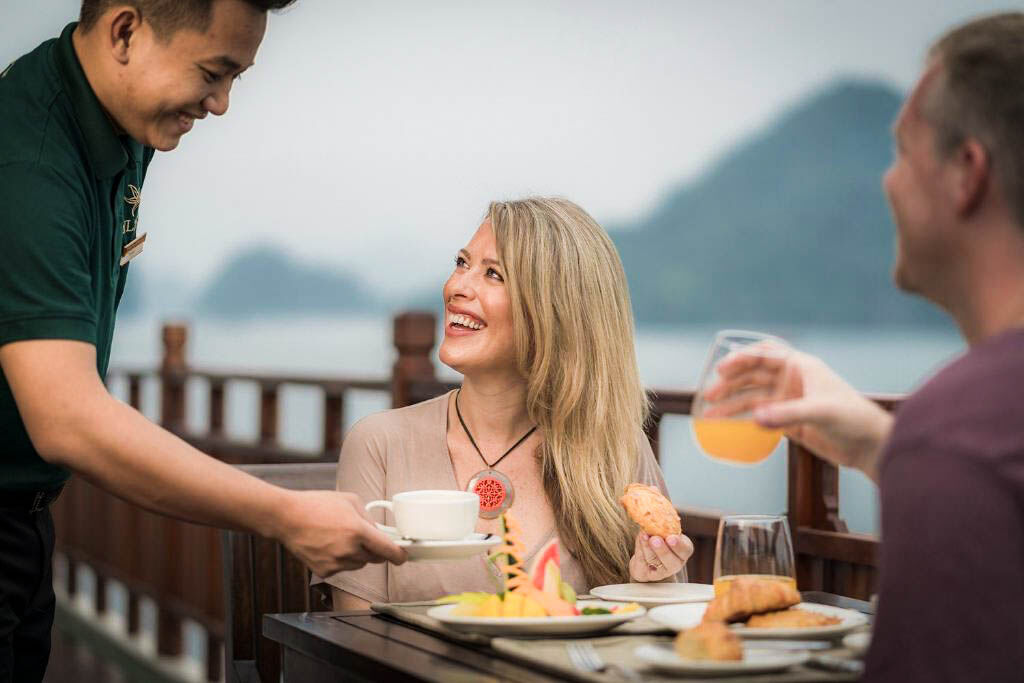 Savor gourmet dining while anchored among Halong Bay’s islands