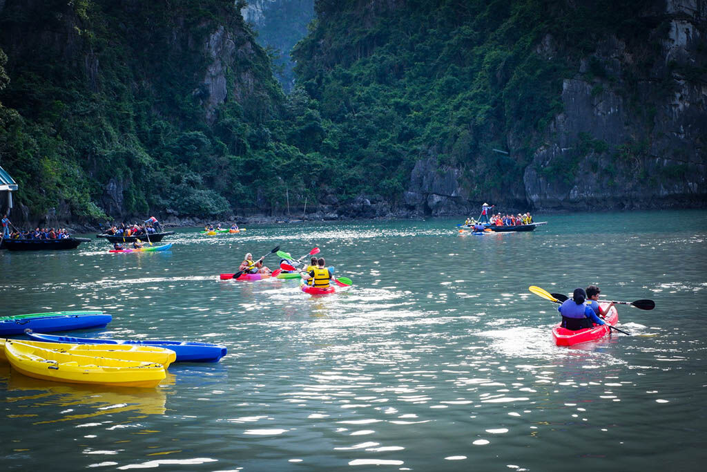 Paddle through hidden lagoons on Halong Bay Tours