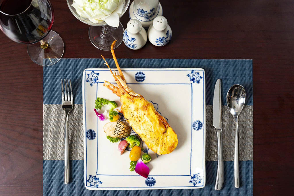Savor gourmet dining while anchored among Halong Bay’s islands