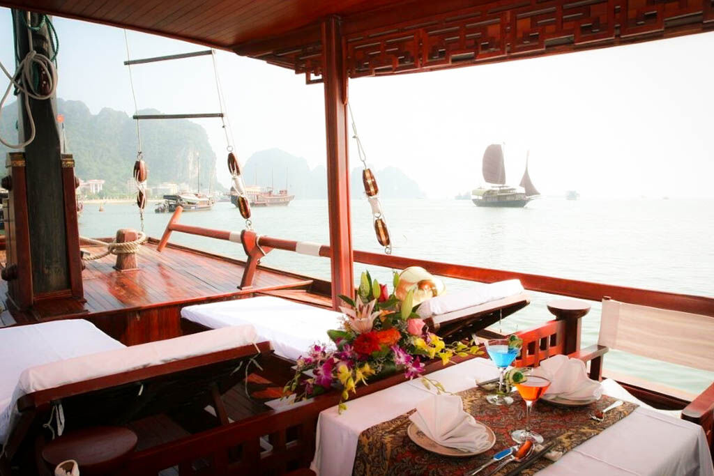 Savor gourmet dining while anchored among Halong Bay’s islands