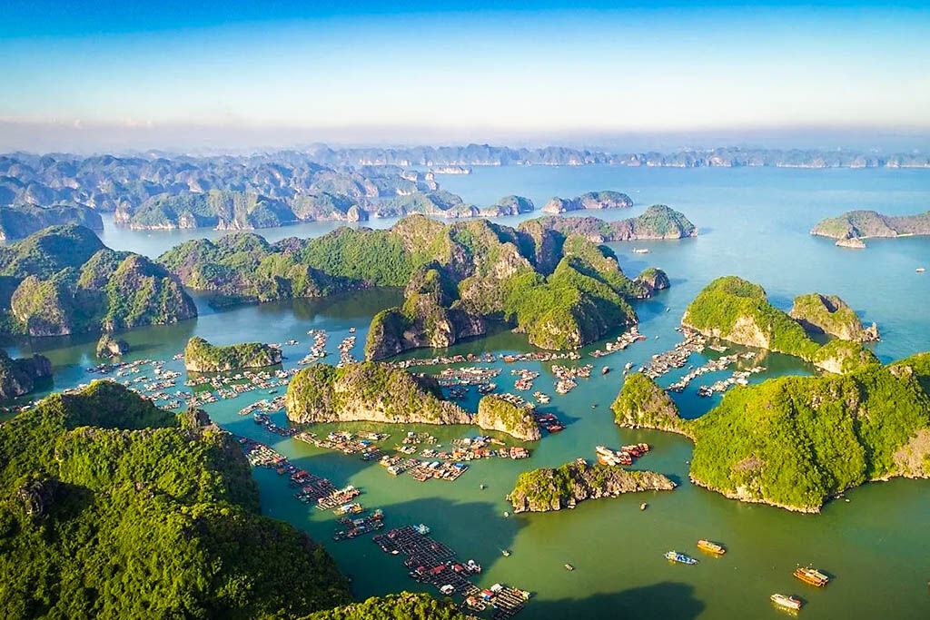 Cruise through the emerald waters and iconic rock formations of Halong Bay