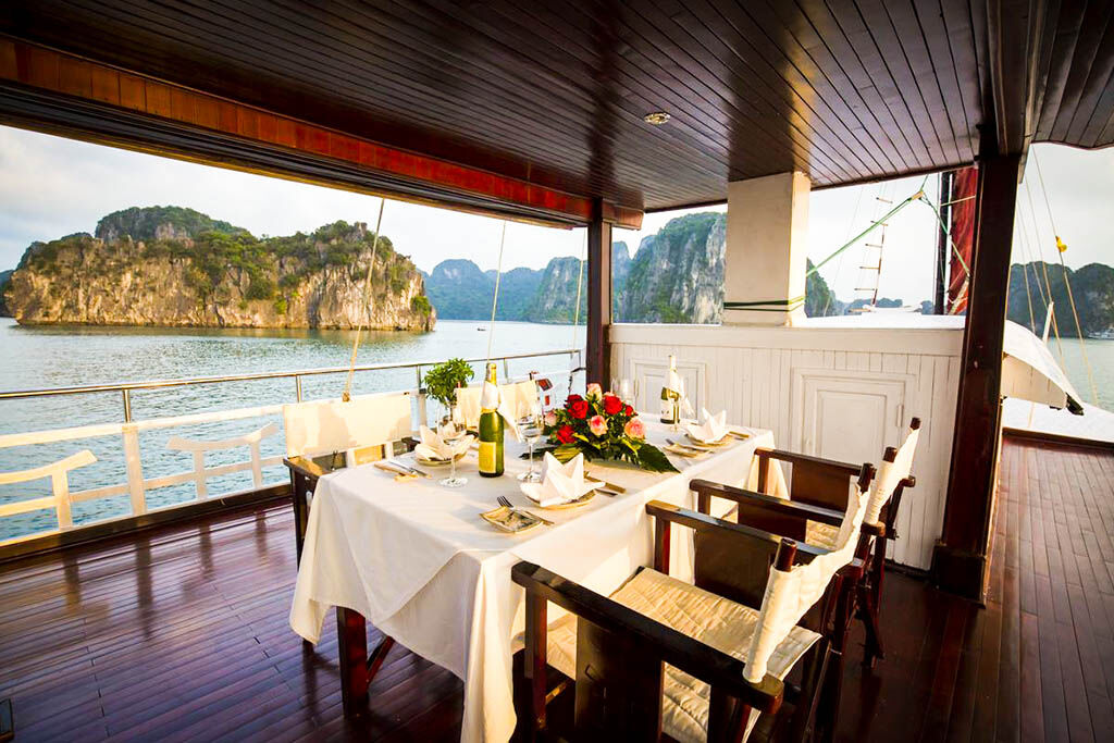 Savor gourmet dining while anchored among Halong Bay’s islands